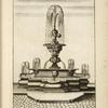 Tri-level fountain with elaborate central spout.