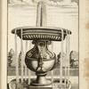 Fountain with large vaselike base and central basin.