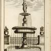 Multi-level fountain with statue of woman holding a plate