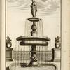 Multi-level fountain with statue of woman holding a plate.