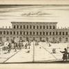 Large three-storied building with groups of people in front