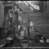 Woman washing youngest child in tenement backyard (1904)