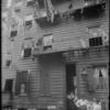 Backyard with several people (1905).
