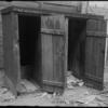 Cluttered Outhouses (1905).