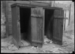 Cluttered Outhouses (1905).