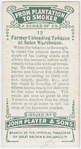 Farmer unloading tobacco at sales warehouse.