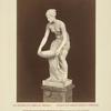 Nude woman carrying basin