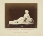 Statue of nude woman holding cup and laying on animal skin