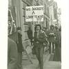 GAA Board of Education zap. Man with sign: Was Socrates a lousy teacher?