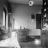 Kitchen with ornate stove and dishes.