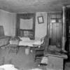 Inhabited room with stove, tubs, beds