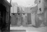 Backyard with laundry and outhouses