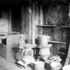 Approximately 10 irons on stove