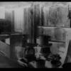 Approximately 10 irons on stove