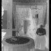 Interior of room with woman & furniture