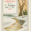 Winding brook in snowy field