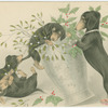 Dogs playing with vase of mistletoe and holly.