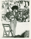 Guitar player at GAA fashion show, 1971 Jun 20