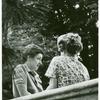 Two women on a bridge