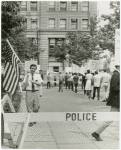 Leo Skir with American flag in picket line