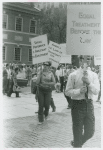 Woman with belt in picket line