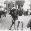 Women picketing while holding hands, detail