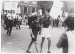 Women picketing while holding hands, detail