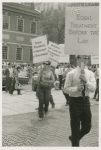 Woman with belt in picket line, enlargement