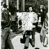 Man with "Gay is Angry, Gay is Proud" sign