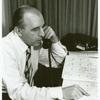 Frank Kameny with calendar, on phone