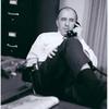 Frank Kameny on phone in his office