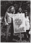 Man and woman with "All You Need is Love" sign