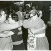 Isabel Miller and Barbara Gittings hugging librarians