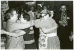 Isabel Miller and Barbara Gittings hugging librarians