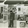 Psychiatrists looking at "Gay Proud and Healthy" display #2