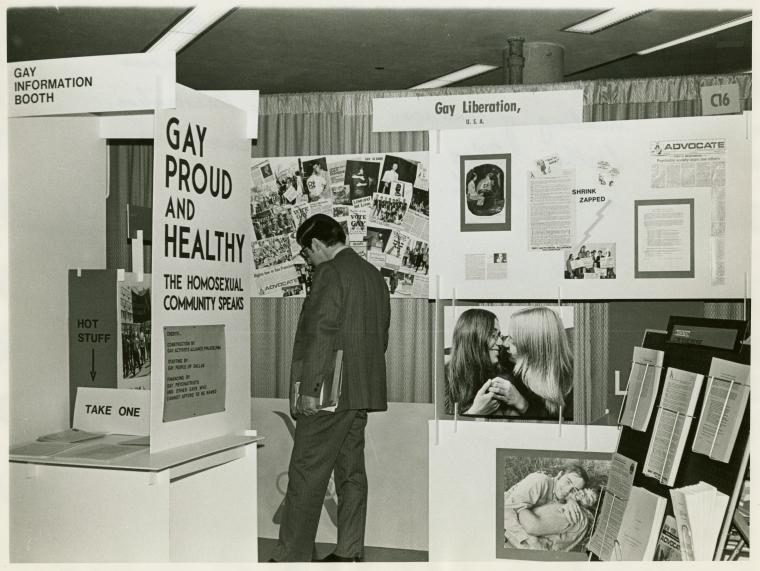 Psychiatrists looking at "Gay Proud and Healthy" display 2 NYPL