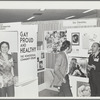 Kameny talking to psychiatrist at "Gay, Proud, and Healthy" display