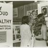 Psychiatrists looking at "Gay, Proud and Healthy" display #3