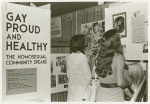 Psychiatrists looking at "Gay, Proud and Healthy" display #3