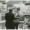Gittings talking with psychiatrist at the "Gay, Proud and Healthy" display