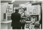 Gittings talking with psychiatrist at the "Gay, Proud and Healthy" display