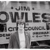 Jim Owles in front of campaign banner