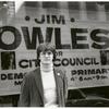 Jim Owles in front of campaign banner