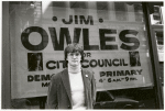 Jim Owles in front of campaign banner