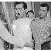 Robert Goulet (center) being costumed for the stage production Camelot
