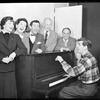 Betty Comden, Rosalind Russell, Adolph Green, George Abbott, Lehman Engel, and Leonard Bernstein (at piano) in rehearsal for the stage production Wonderful Town, 1953.