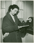 Publicity series: Betty Miller clocking in a few minutes before her shift at the stocking counter.