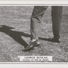 George Duncan. Stance at top of swing.