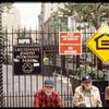 Petrosino Park Installation (Men with Do Nothing and official park sign)
