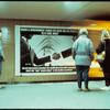 When a Government Turns Its Back on Its People, Is It Civil War? (Berlin subway billboard with multiple people)